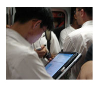 commuter reading an e-book